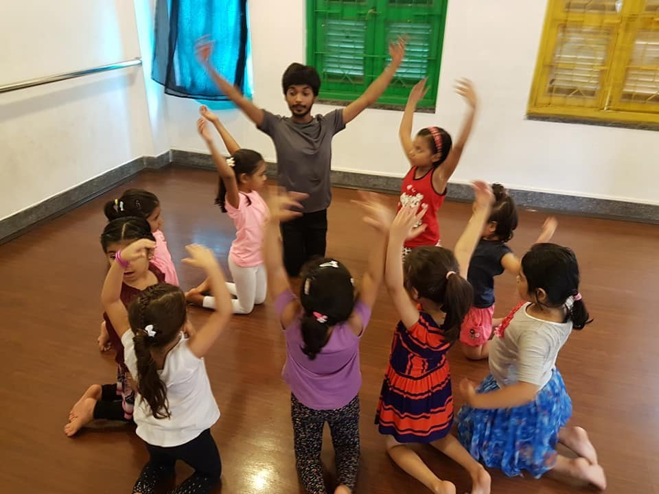 Children joyfully dancing in a dance class