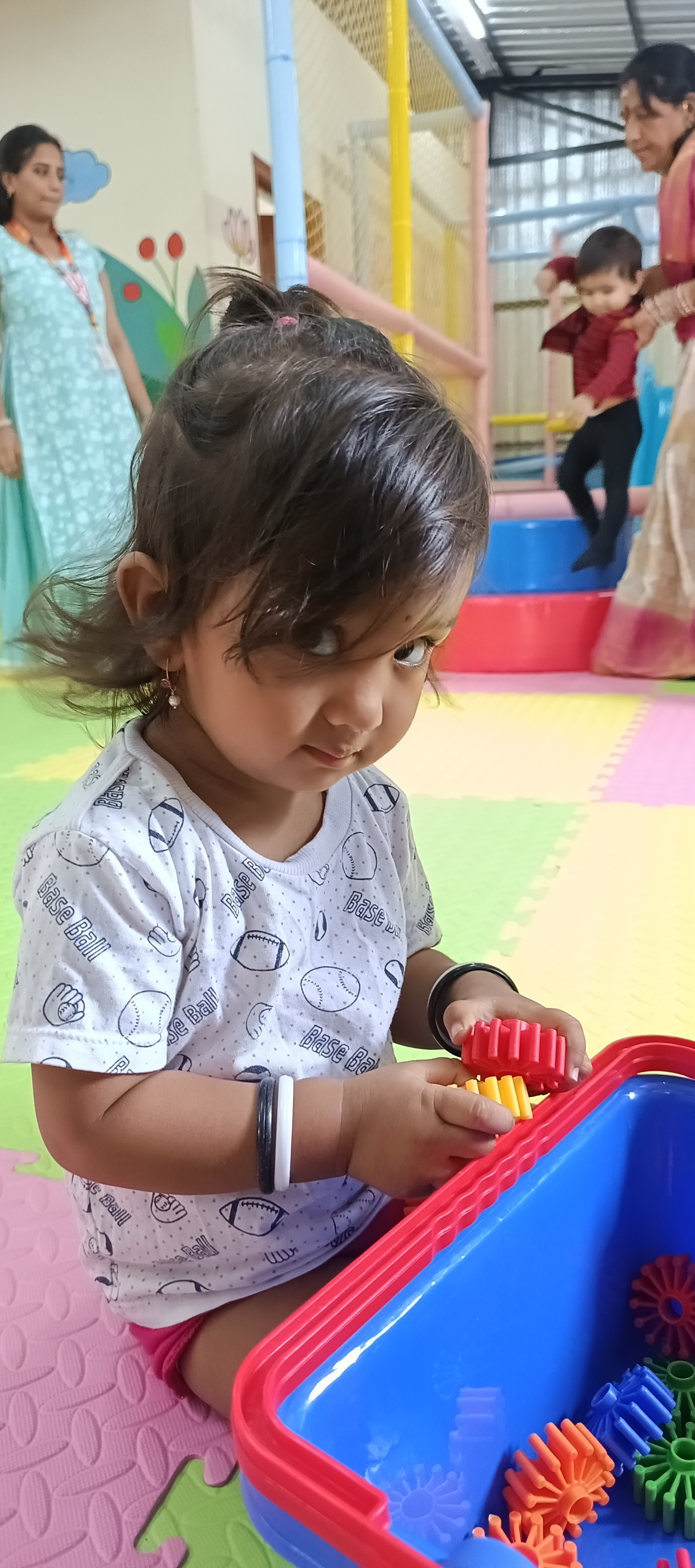 Young minds creating shapes together in play sand