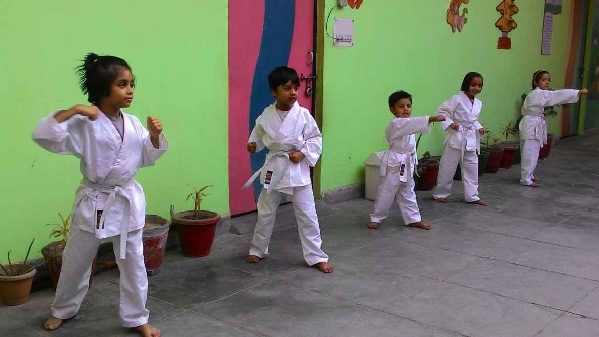 Children practicing karate in a disciplined setting