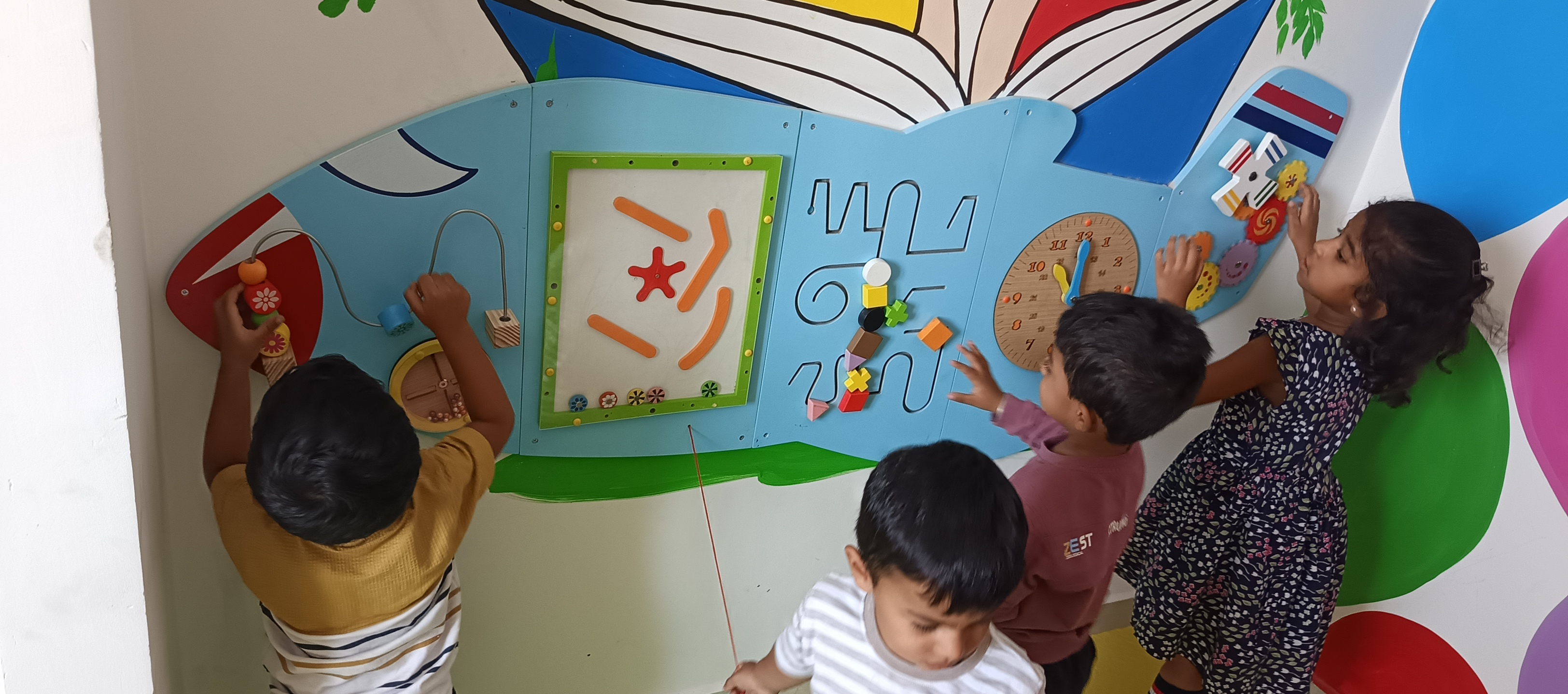 Children engaging in hands-on creative play and sensory learning at Success Kids